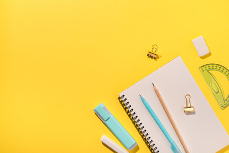 School supplies on yellow background. Back to school concept. Top view. Copy space.の写真素材