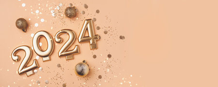 Golden 2024 on a peach color background with confetti and bokeh lights. Happy New Year 2024 is...