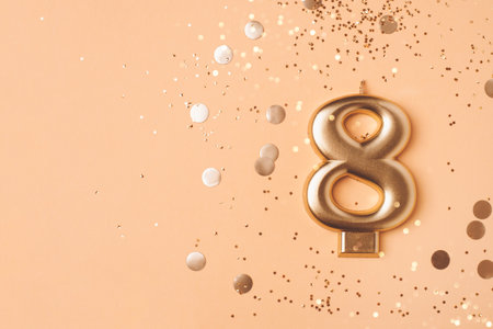 Gold candle in the form of number eight.の写真素材