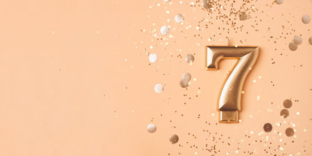 Gold candle in the form of number seven.の写真素材