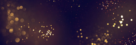 Golden abstract bokeh on black background. Celebrating Christmas, New Year or other holidays.の写真素材