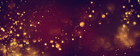 Golden abstract bokeh on black background. Celebrating Christmas, New Year or other holidays.の写真素材