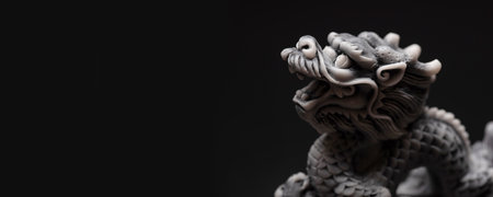 Gray dragon statue on a black background. The symbol of 2024. Happy Chinese New Year.の写真素材