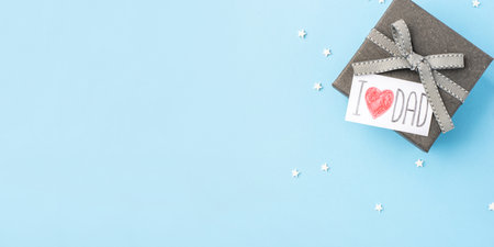 A gray gift box with a Fathers Day greeting card.の写真素材