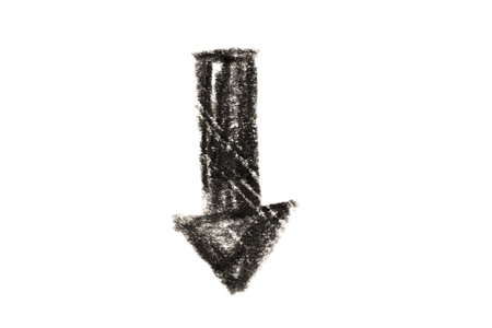 A photo of a black arrow pointing down on a white background.の写真素材