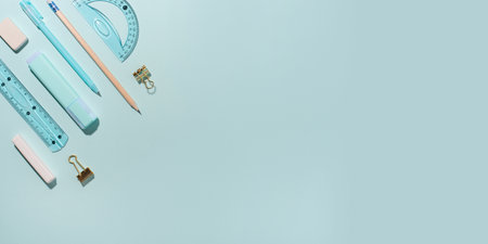 School supplies on blue background. Back to school concept. Top view. Copy space.の写真素材