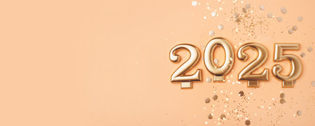 Golden 2025 on a peach color background with confetti and bokeh lights. Happy New Year 2025 is coming concept. Top view.の写真素材