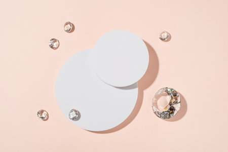 White podium with diamonds on a pink background for product presentation. Minimal concept and hard sunlight. Top viewの写真素材