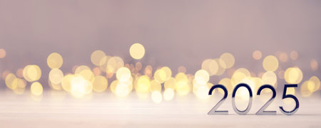 Metal numbers 2025 on table with bokeh lights.の写真素材