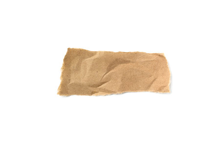 A torn piece of craft paper on a white backgroundの写真素材