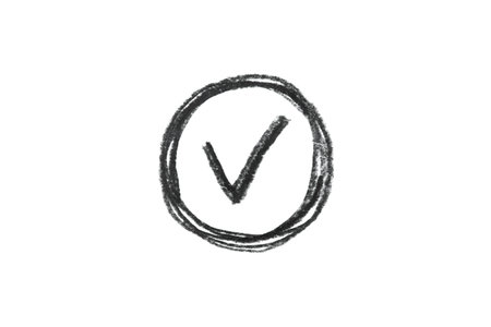 A black pencil sketch of a check mark symbol on a white background.の写真素材