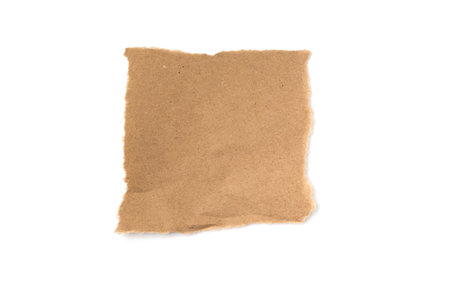 A torn piece of craft paper on a white backgroundの写真素材