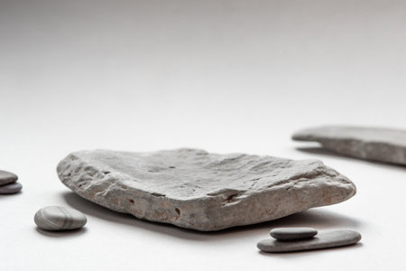 Background for cosmetic products of natural colors. Stone podium on a gray background. Front view.の写真素材