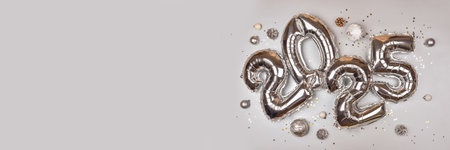 2025 Silver Balloon Numbers with Holiday Decorationsの写真素材