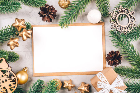 Christmas Frame with Blank Space for Text. Festive Holiday Background with Pine Branches and Ornamentsの写真素材