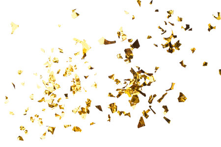 Golden Foil Confetti Scattered on White Backgroundの写真素材