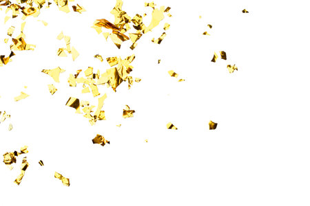 Golden Foil Confetti Scattered on White Backgroundの写真素材