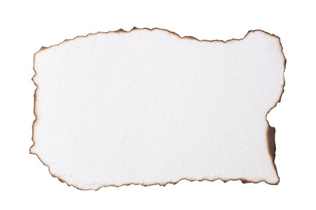 A piece of white paper with burnt edges isolated on a white backgroundの写真素材