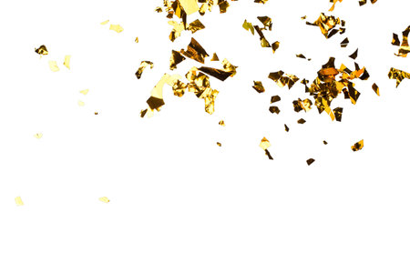 Golden Foil Confetti Scattered on White Backgroundの写真素材