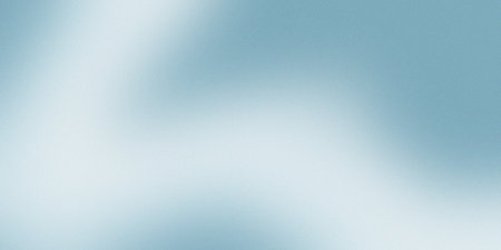 Soft gradient background with a smooth transition of blue tones complemented by a subtle noise textureの写真素材