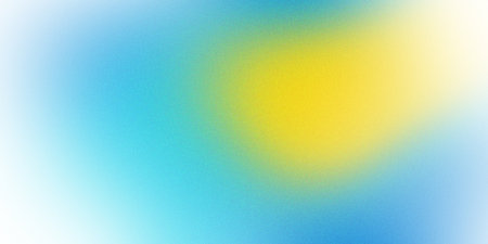 A vibrant gradient background with vibrant blue and yellow hues blending seamlessly into each other. A design with a subtle noise texture that adds depth and visual interest.の写真素材