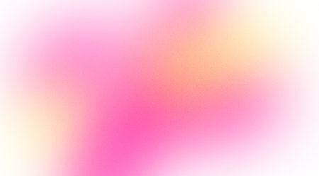 Abstract design element in the form of a blurred gradient in pink and yellow tones with grain...