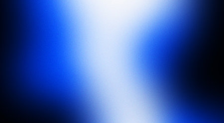 A vibrant gradient background with vibrant blue hues blending seamlessly into black. Banner with grain textureの写真素材