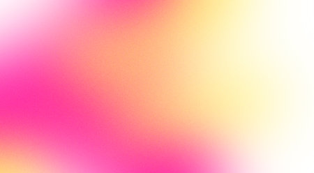 Abstract design element in the form of a blurred gradient in pink and yellow tones with grain textureの写真素材