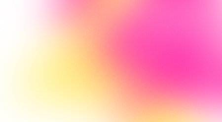 Abstract design element in the form of a blurred gradient in pink and yellow tones with grain textureの写真素材