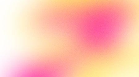 Abstract design element in the form of a blurred gradient in pink and yellow tones with grain textureの写真素材