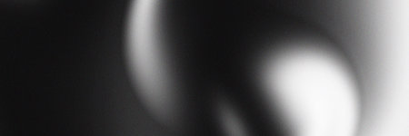 Abstract black and white background with a grainy texture. Perfect for banners, posters, headlines and covers.の写真素材