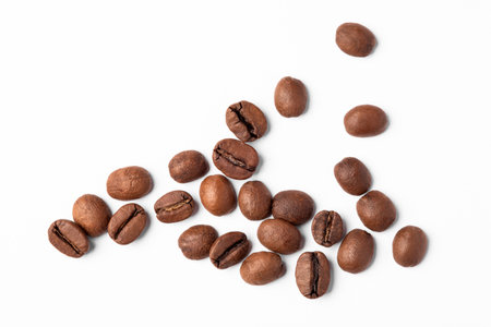 Freshly roasted coffee beans on a white backgroundの写真素材