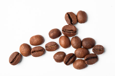 Freshly roasted coffee beans on a white backgroundの写真素材