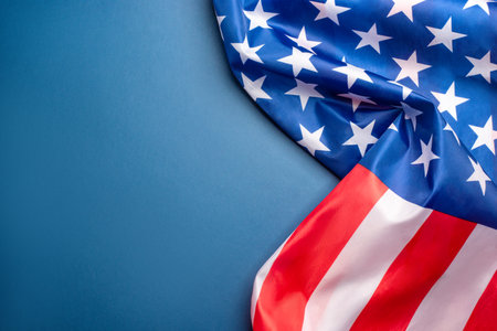 Blue background with American flag. Independence day. Website banner and greeting card design template.の写真素材
