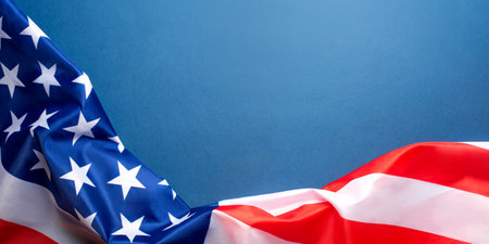Blue background with American flag.の写真素材