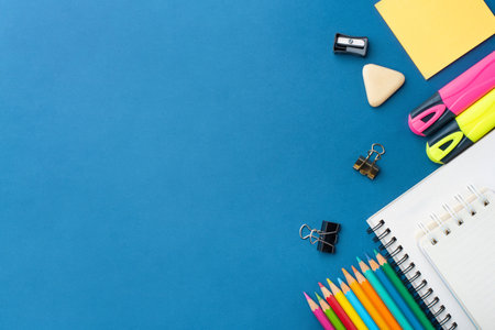 Bright school supplies on a blue background. The back to school conceptの写真素材