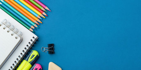 Bright school supplies on a blue background. The back to school conceptの写真素材