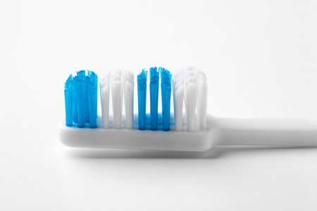 Blue toothbrush on a white background. Close upの写真素材
