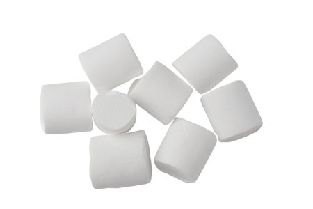 A pile of white marshmallows isolated on a white backgroundの写真素材