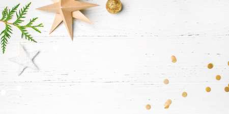 Festive Christmas background with Christmas decorations on white wooden table. Top view. Copy space...