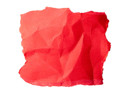 Red torn cardboard isolated on a white backgroundの写真素材