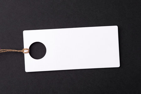 Empty white tag on black background.