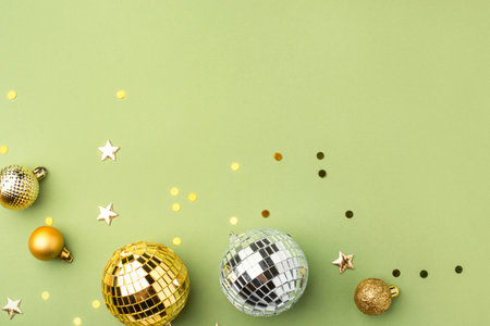 Festive Christmas ornaments on a green background.の写真素材