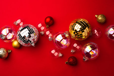 Festive Christmas ornaments on a red background.の写真素材