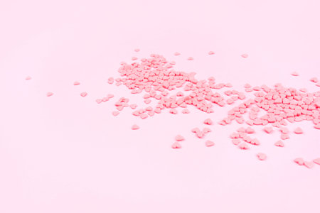 Pink background with tiny hearts. Valentine's day concept. Top view.の写真素材