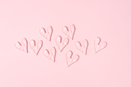 Valentine's day concept. Pink hearts on pink background.