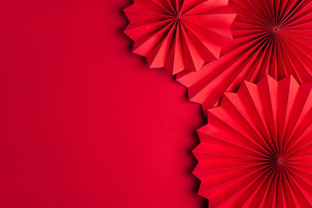 Red paper fans on a red background. Chinese New Year Celebrationの写真素材
