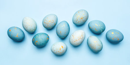Easter background of eggs painted in blue color. Flat lay, top view.