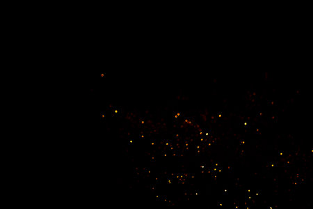 Golden abstract bokeh on black background. Holiday concept