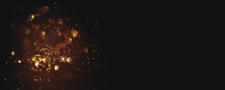 Golden abstract bokeh on black background. Holiday conceptの写真素材